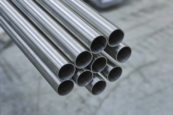 Industrial oil and gas facility with metal structures and pipelines