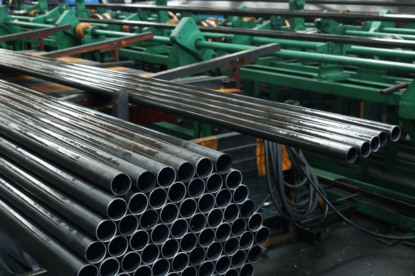 Industrial oil and gas facility with metal structures and pipelines