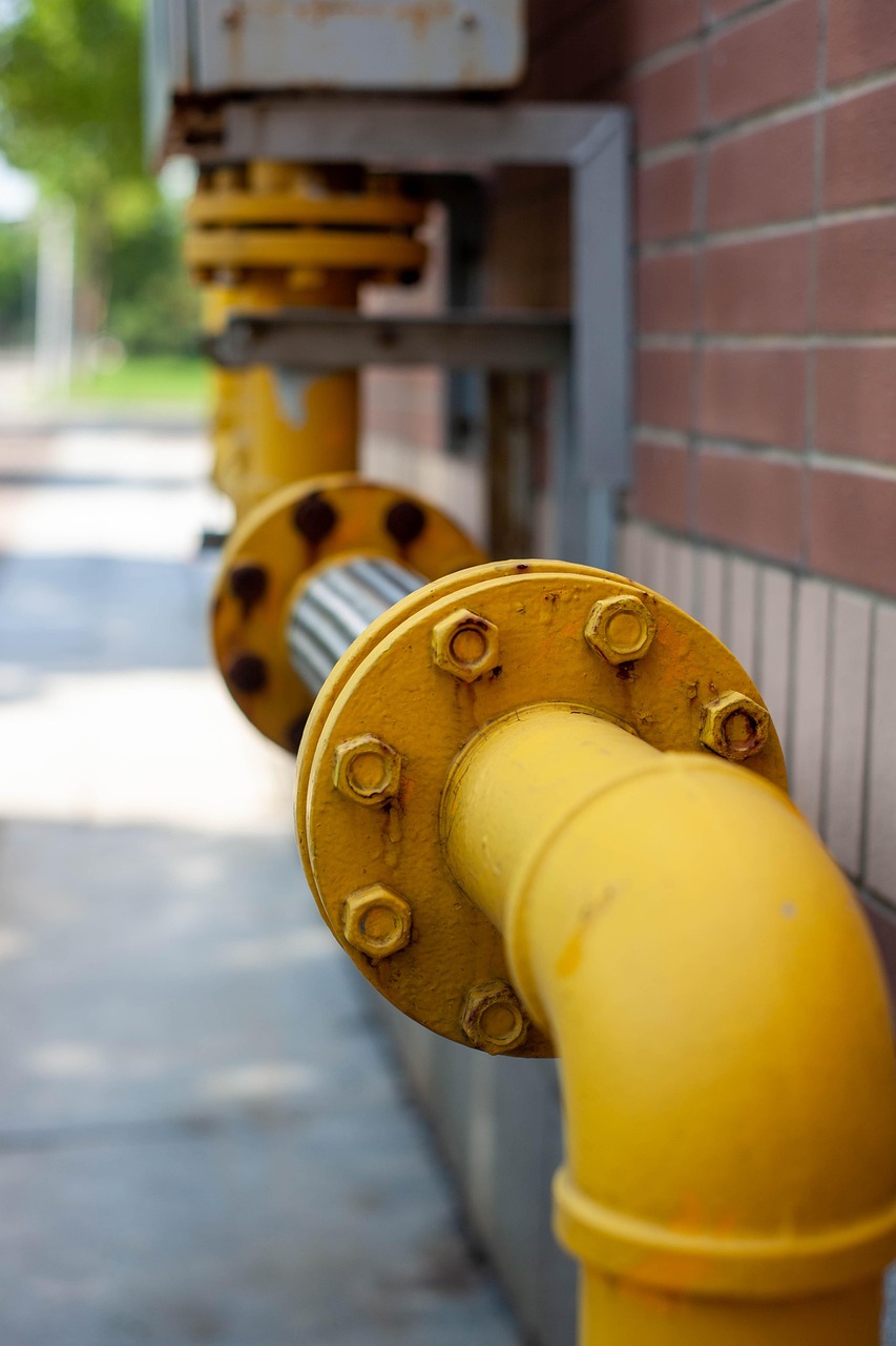 Industrial oil and gas facility with metal structures and pipelines