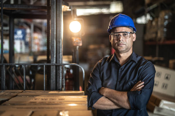 Engineer inspecting industrial pipes and equipment
